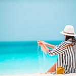 Young beautiful woman on beach vacation on Caribs