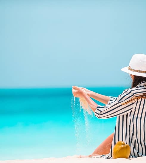 Young beautiful woman on beach vacation on Caribs